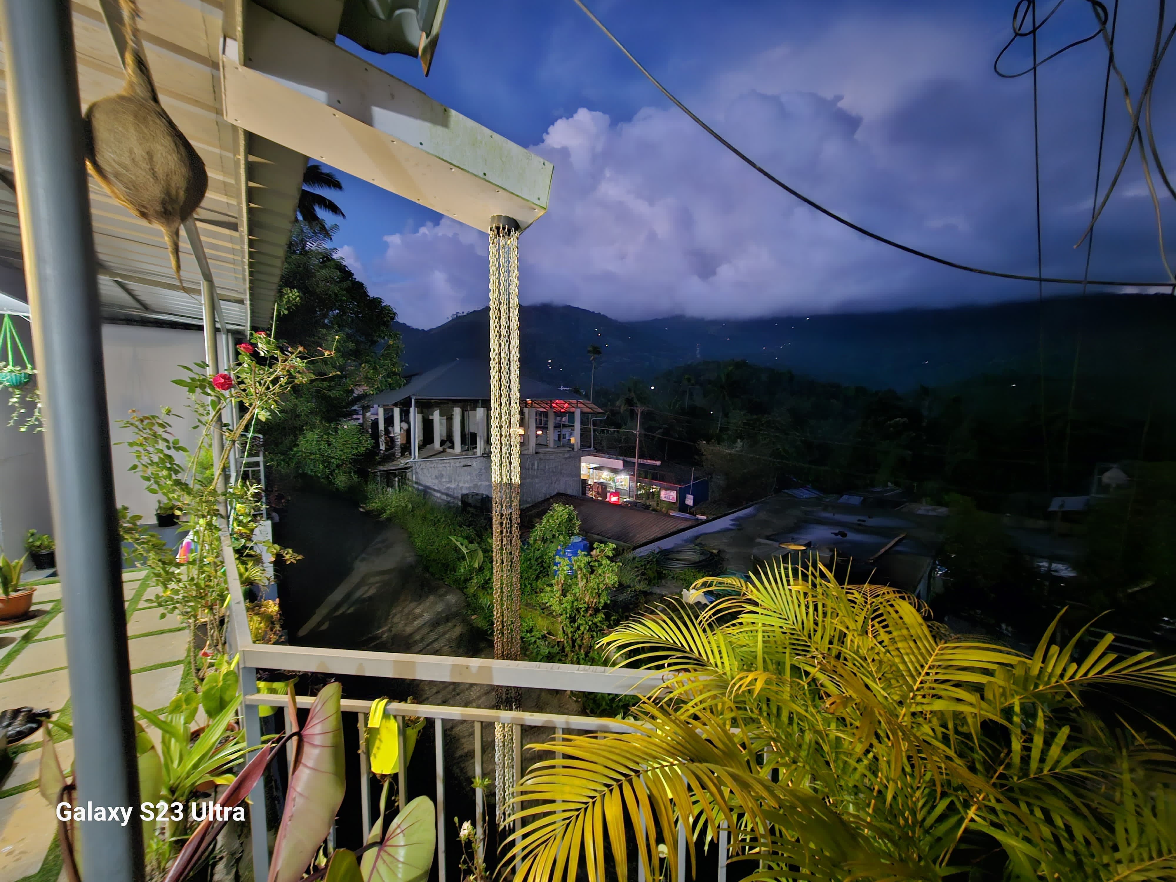Bhaskar Home main building with Kerala traditional architecture surrounded by lush gardens and mountain views