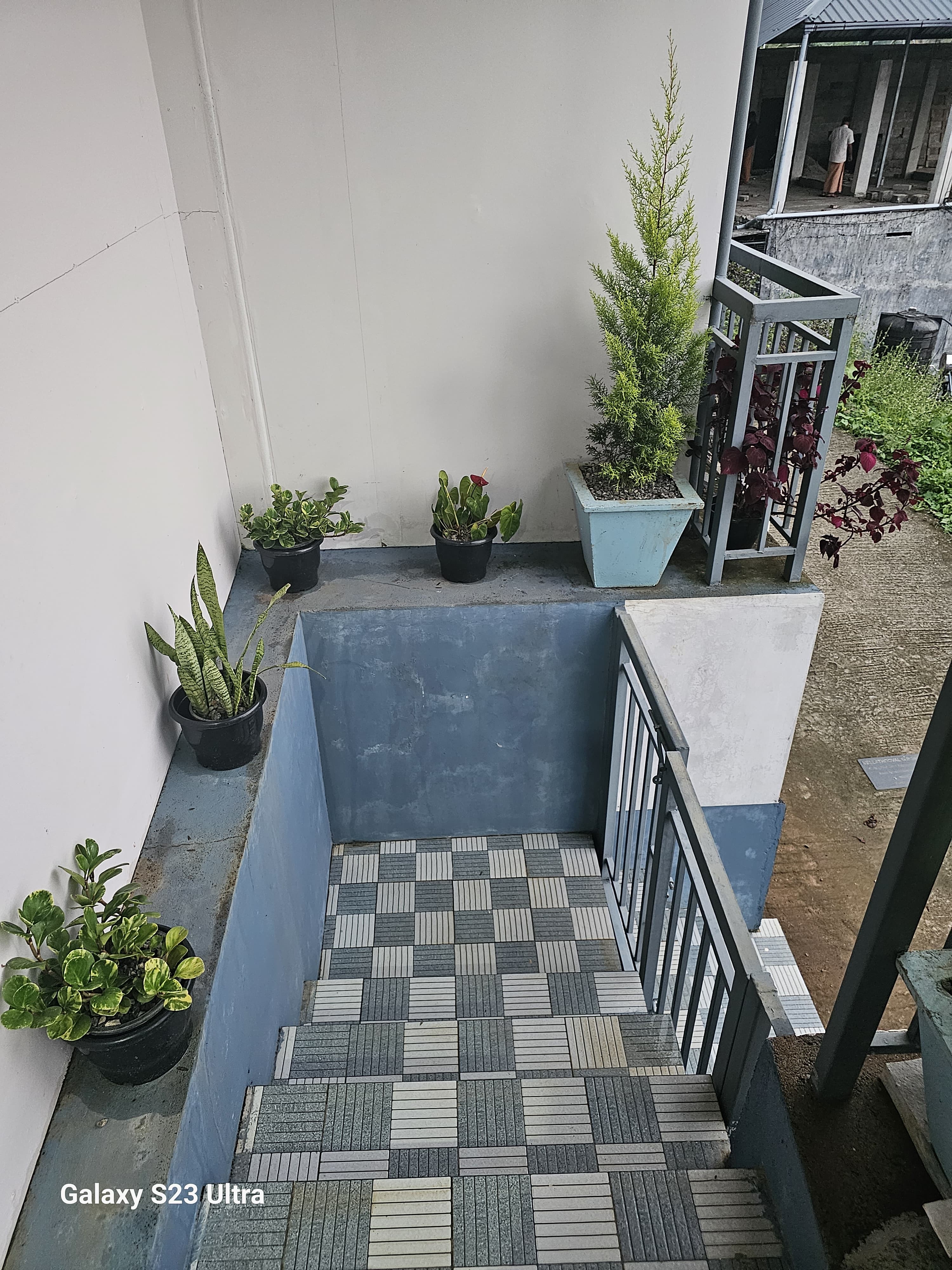 Bhaskar Home exterior showcasing well-maintained garden areas and peaceful outdoor seating spaces